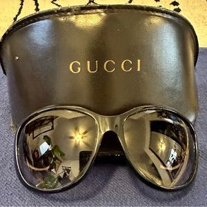 Black and gold Gucci sunglasses